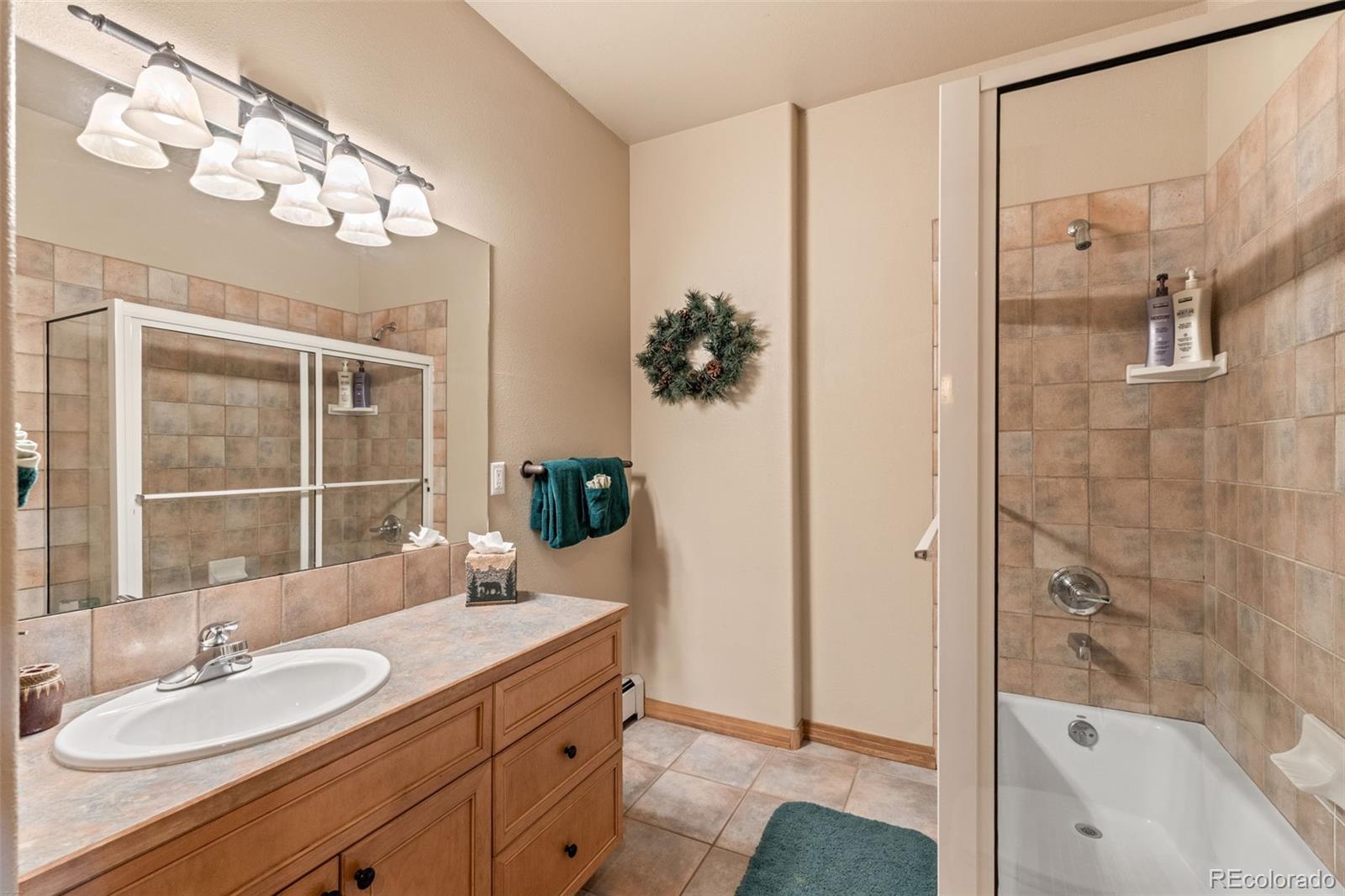 92 Emmett Lode Road, Unit B Breckenridge, CO 80424 - Photo 30 of 50 a bathroom with a sink double vanity and shower