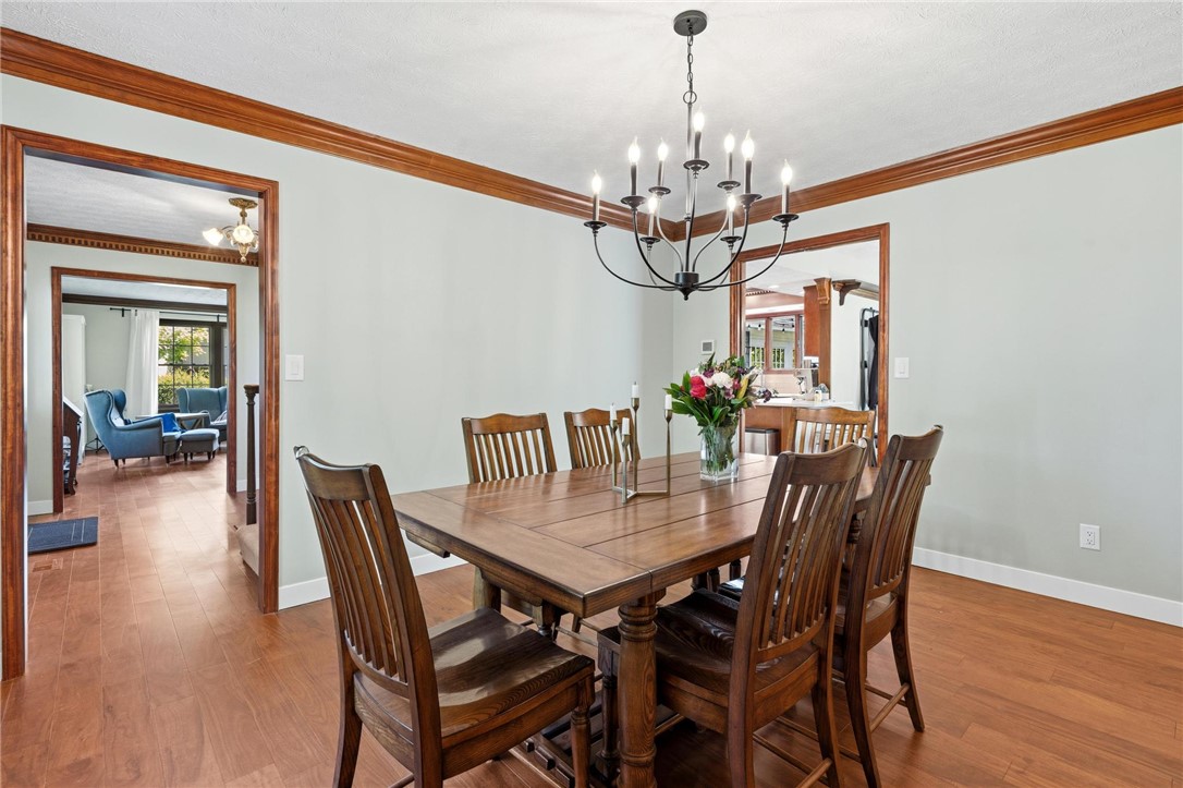 10168 Atchison Road Dayton, OH 45458 - Photo 19 of 44 Elegant dining room with beautiful hardwood floors, ideal for gatherings.