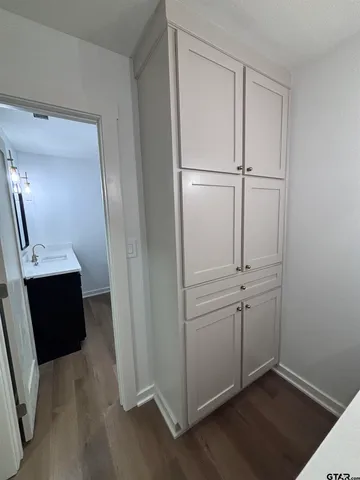 a bathroom with a sink a bathtub and a mirror