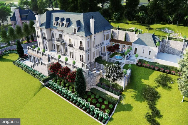 a aerial view of a house with a swimming pool outdoor seating and yard