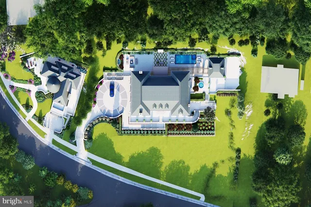 an aerial view of a house with a garden and swimming pool