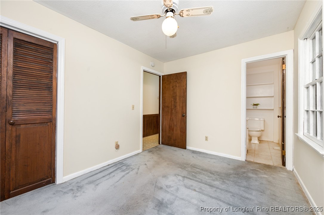 2470 Hickory House Road Sanford, NC 27332 - Photo 12 of 27 a view of an empty room with a ceiling fan