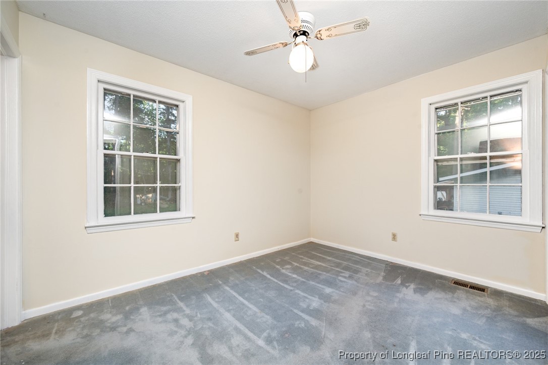 2470 Hickory House Road Sanford, NC 27332 - Photo 14 of 27 a view of empty room with windows