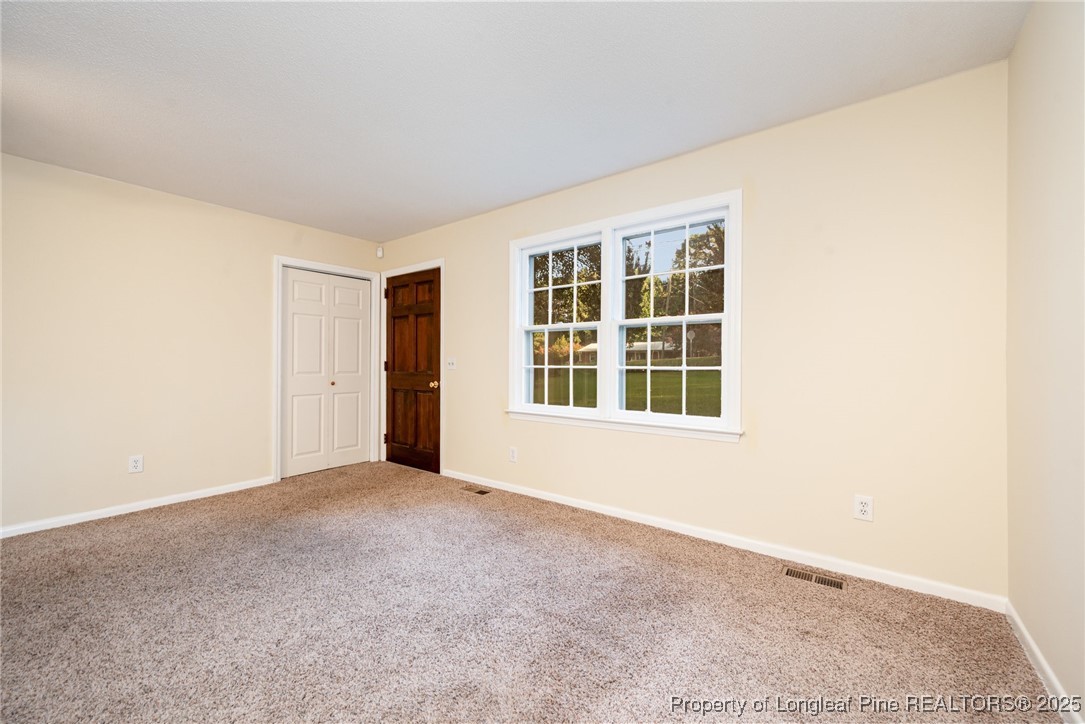 2470 Hickory House Road Sanford, NC 27332 - Photo 18 of 27 a view of an empty room with a window