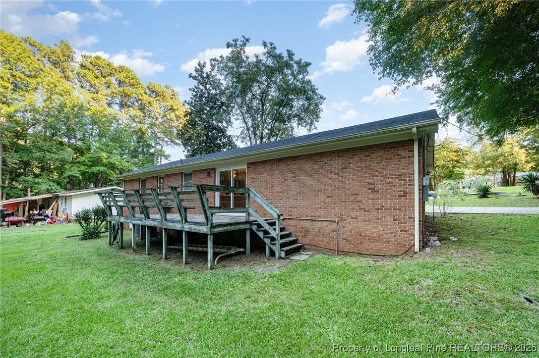 2470 Hickory House Road Sanford, NC 27332 - Photo 20 of 27 a view of a chair and table in the garden