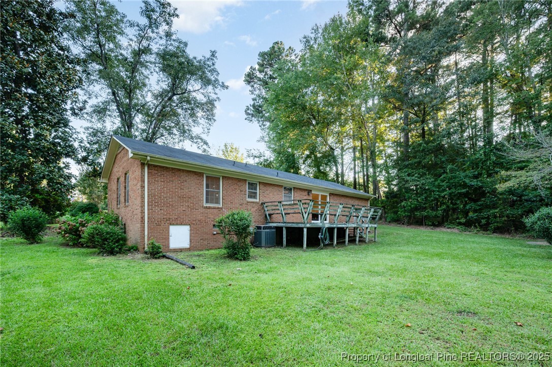 2470 Hickory House Road Sanford, NC 27332 - Photo 23 of 27 a view of a house with backyard and garden