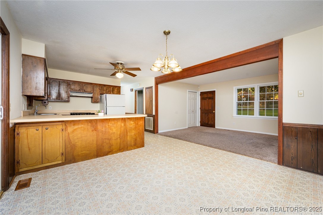 2470 Hickory House Road Sanford, NC 27332 - Photo 4 of 27 a view of kitchen and kitchen with granite countertop sink