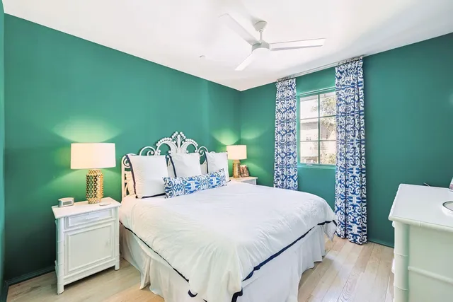 a bathroom with a sink toilet vanity and shower
