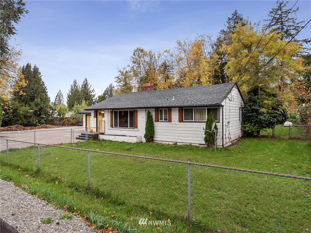 10222 Golden Given Road East Tacoma, WA 98445 - Photo 2 of 23 a front view of a house with a yard