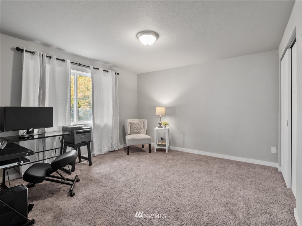 10222 Golden Given Road East Tacoma, WA 98445 - Photo 16 of 23 a view of a livingroom with workspace and a window