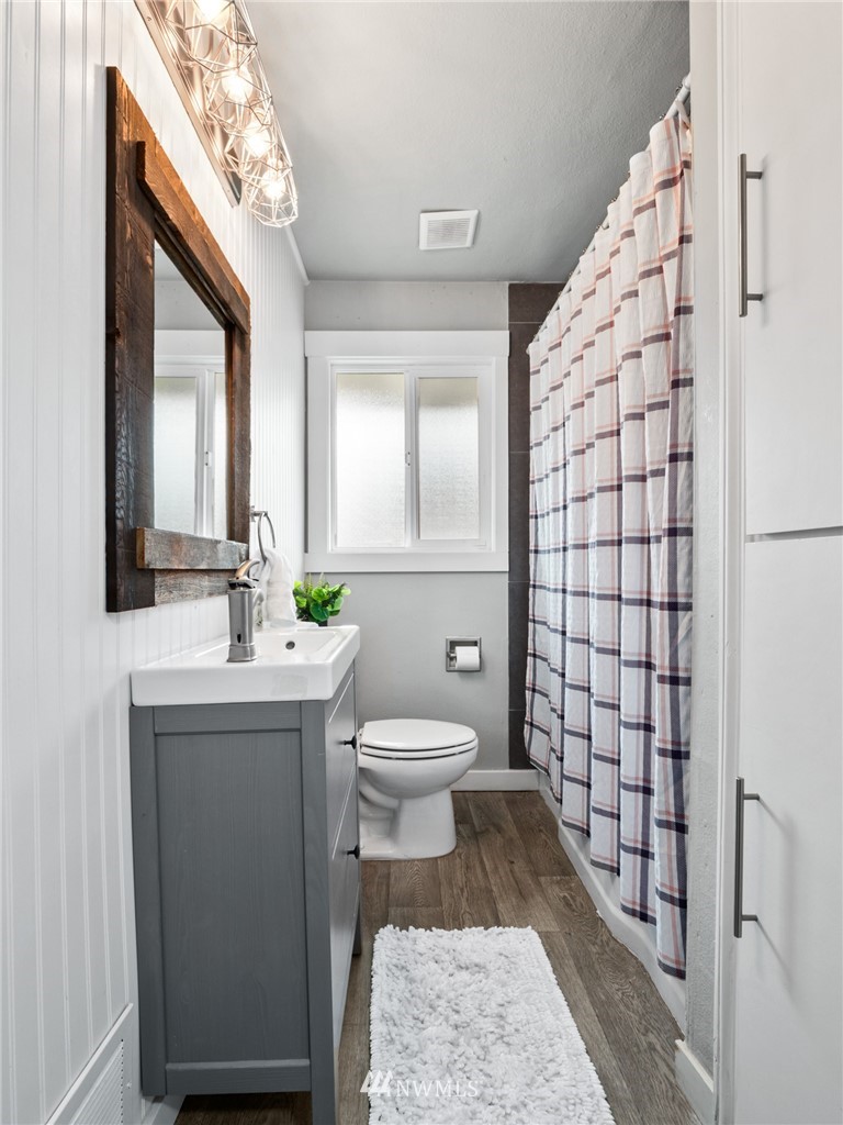 10222 Golden Given Road East Tacoma, WA 98445 - Photo 17 of 23 a bathroom with a sink toilet and shower