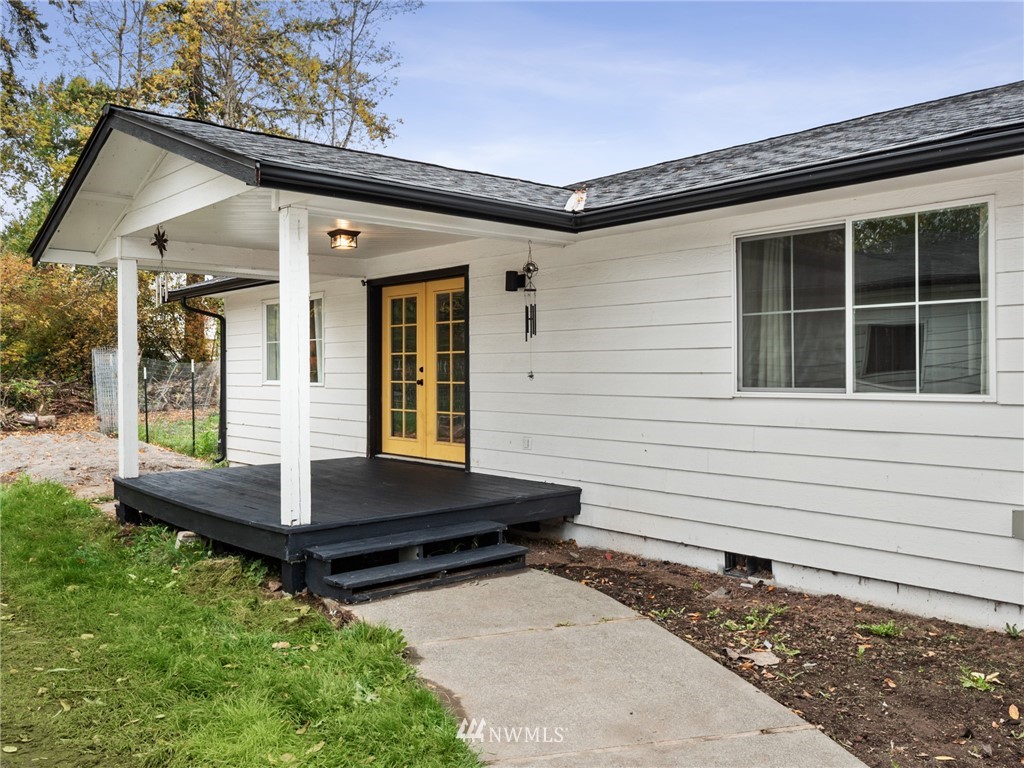 10222 Golden Given Road East Tacoma, WA 98445 - Photo 19 of 23 a front view of house with deck outdoor seating and yard