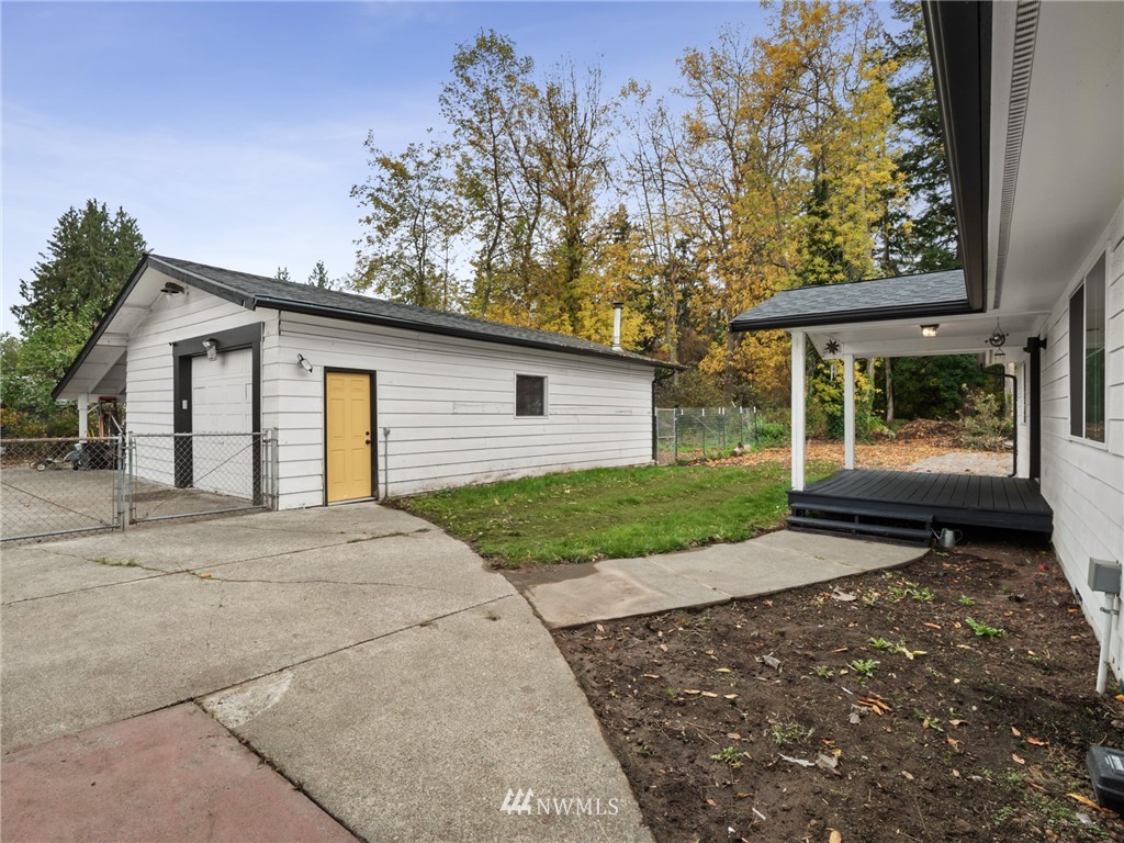 10222 Golden Given Road East Tacoma, WA 98445 - Photo 20 of 23 a view of a house with a yard