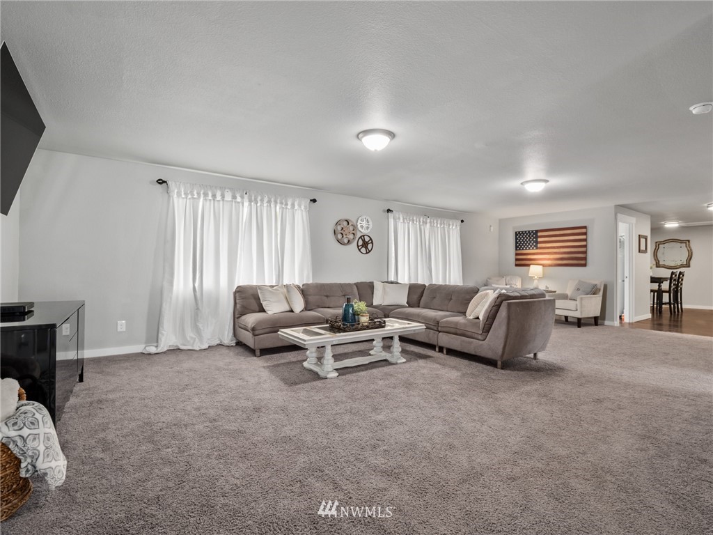 10222 Golden Given Road East Tacoma, WA 98445 - Photo 9 of 23 a living room with furniture and a window