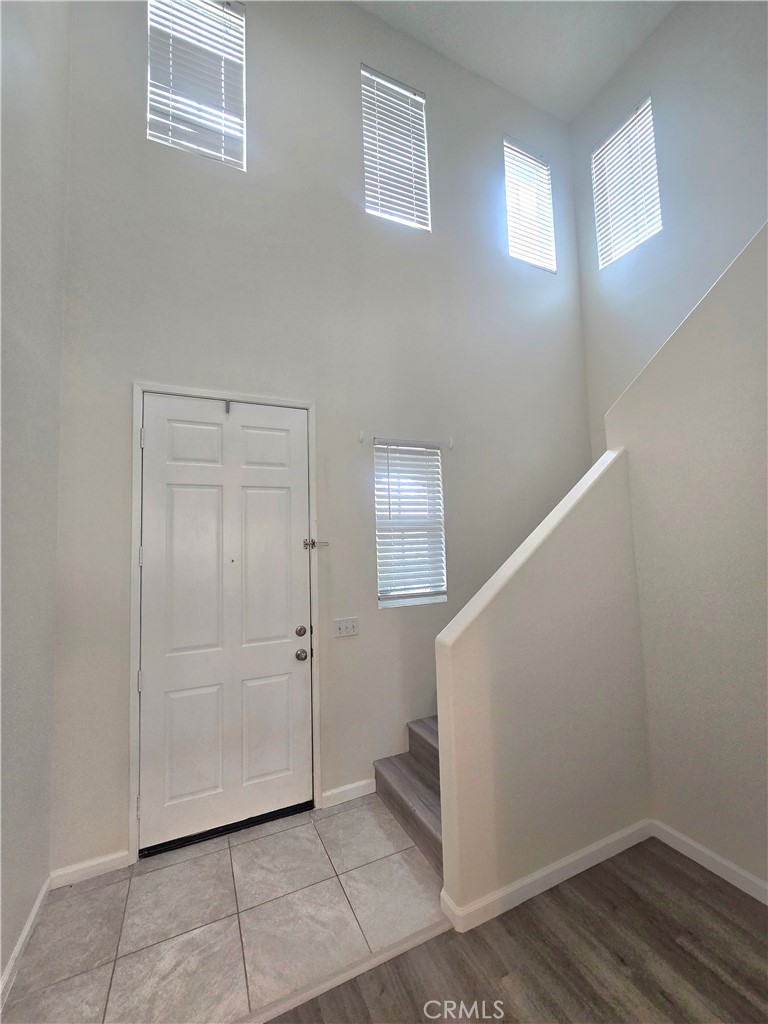 3073 Snowdrop Court Perris, CA 92571 - Photo 7 of 25 a view of an empty room with wooden floor and a window
