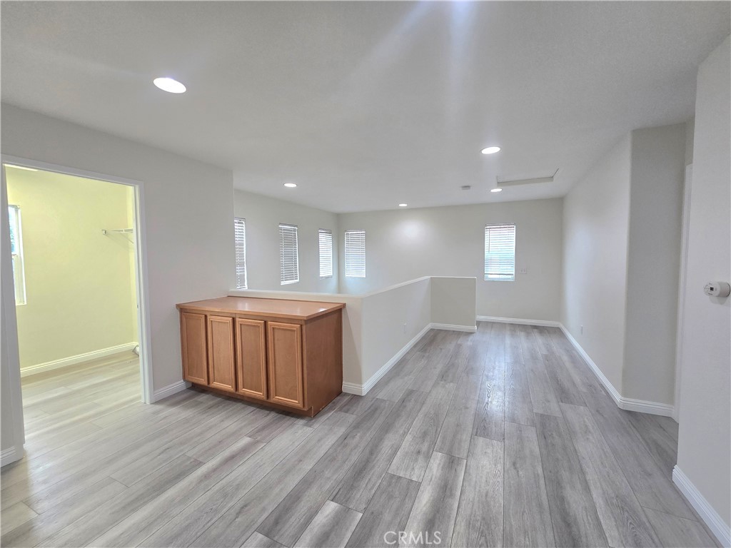 3073 Snowdrop Court Perris, CA 92571 - Photo 10 of 25 a view of an empty room and wooden floor