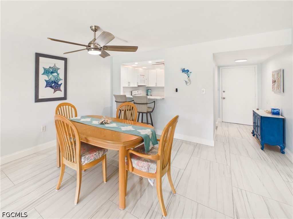 300 Valley Stream Drive, Unit 3D Naples, FL 34113 - Photo 6 of 21 a dining room with furniture and window