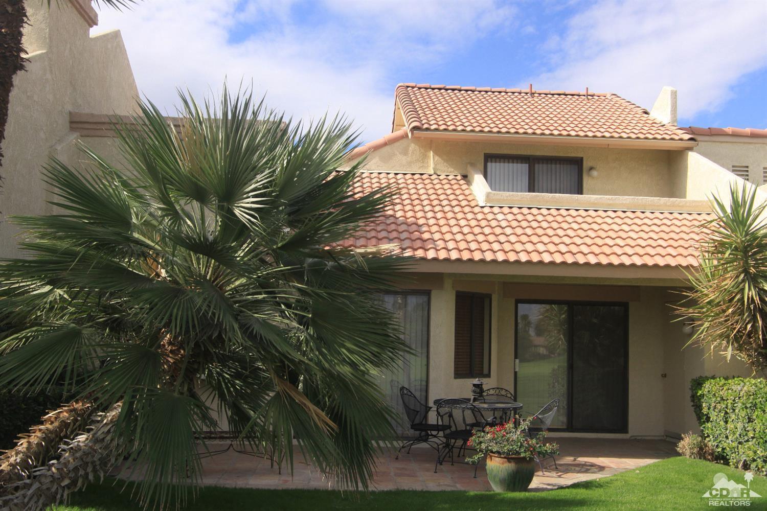 42872 Scirocco Road Palm Desert, CA 92211 - Photo 20 of 23 a view of a house with a yard