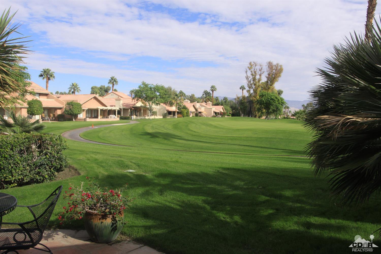 42872 Scirocco Road Palm Desert, CA 92211 - Photo 21 of 23 a view of a golf course with a garden