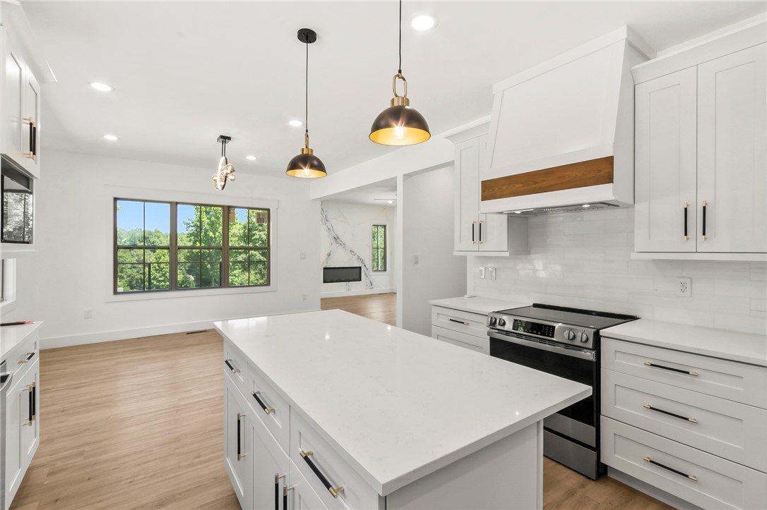 230 Hammond Circle Anderson, SC 29621 - Photo 28 of 48 This modern kitchen features a spacious island and an open view to a bright living area.