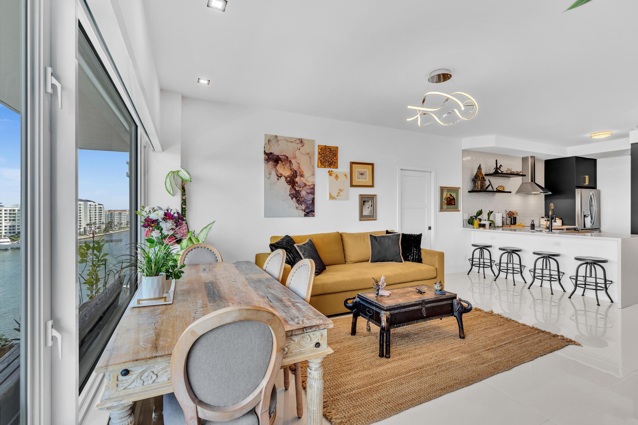 701 East Camino Real, Unit 12G Boca Raton, FL 33432 - Photo 11 of 82 a living room with furniture and a wooden floor