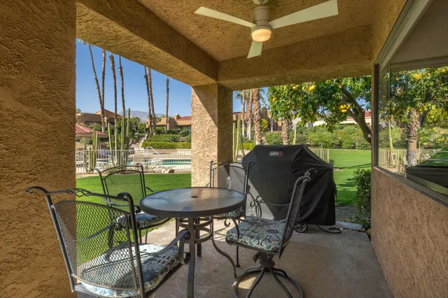 a view of a table and chairs in patio