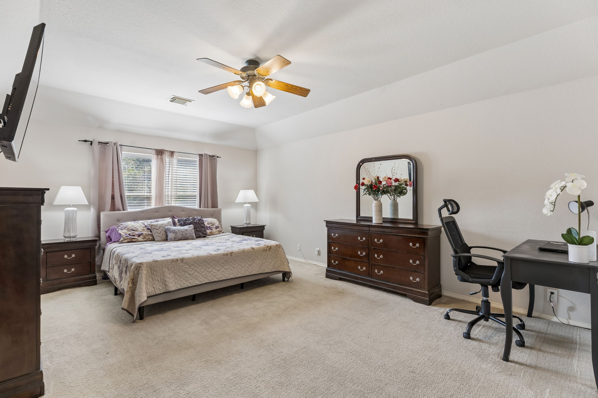 159 Invierno Street Kyle, TX 78640 - Photo 5 of 40 Featuring three bedrooms and two full bathrooms including this oversized and secluded primary suite.