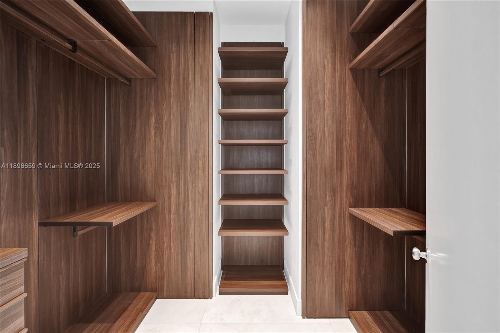 17475 Collins Avenue, Unit 2302 Sunny Isles Beach, FL 33160 - Photo 14 of 42 a view of walk in closet