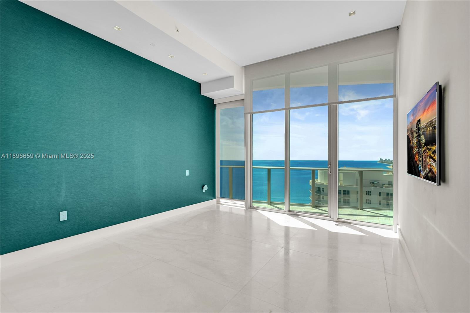 17475 Collins Avenue, Unit 2302 Sunny Isles Beach, FL 33160 - Photo 15 of 42 a view of an empty room with a window