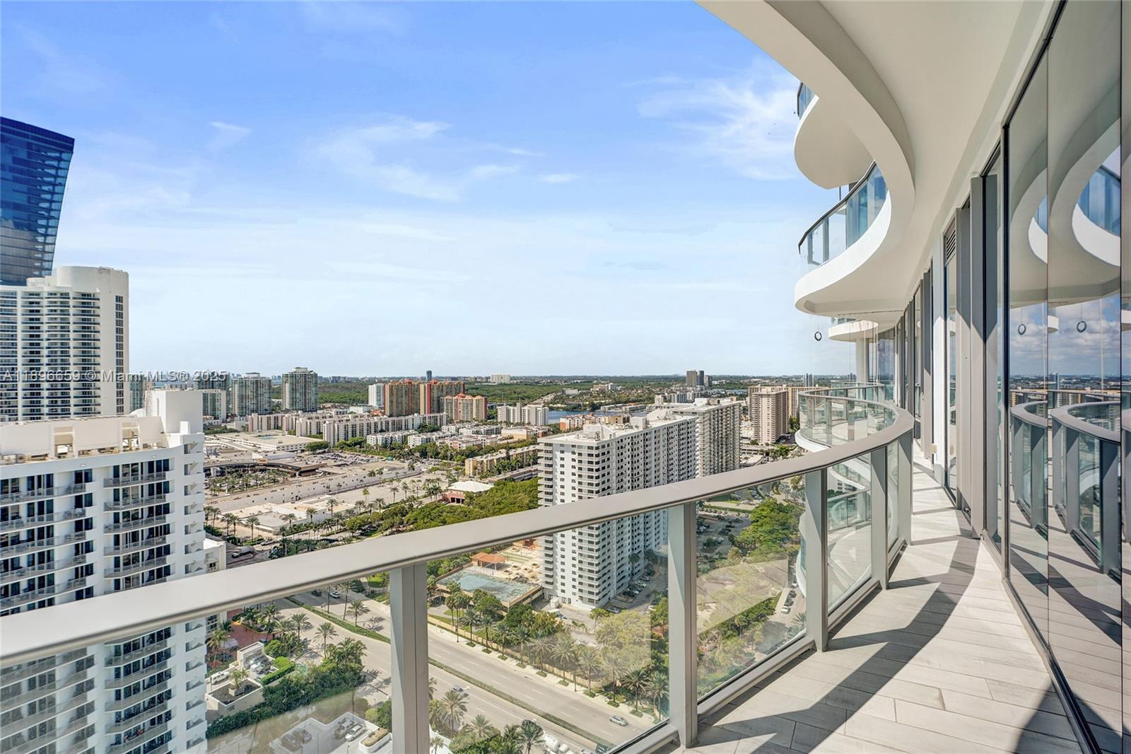 17475 Collins Avenue, Unit 2302 Sunny Isles Beach, FL 33160 - Photo 26 of 42 a view of a balcony with city view