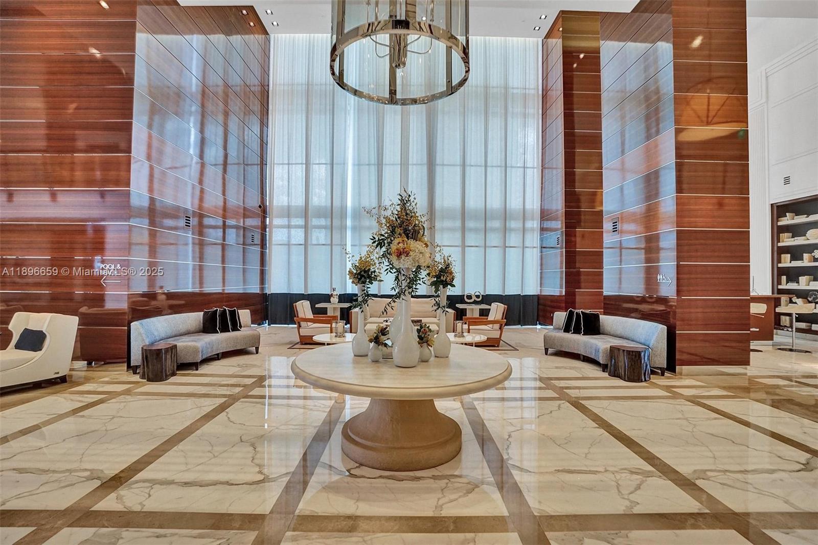 17475 Collins Avenue, Unit 2302 Sunny Isles Beach, FL 33160 - Photo 29 of 42 a view of a dining room with furniture