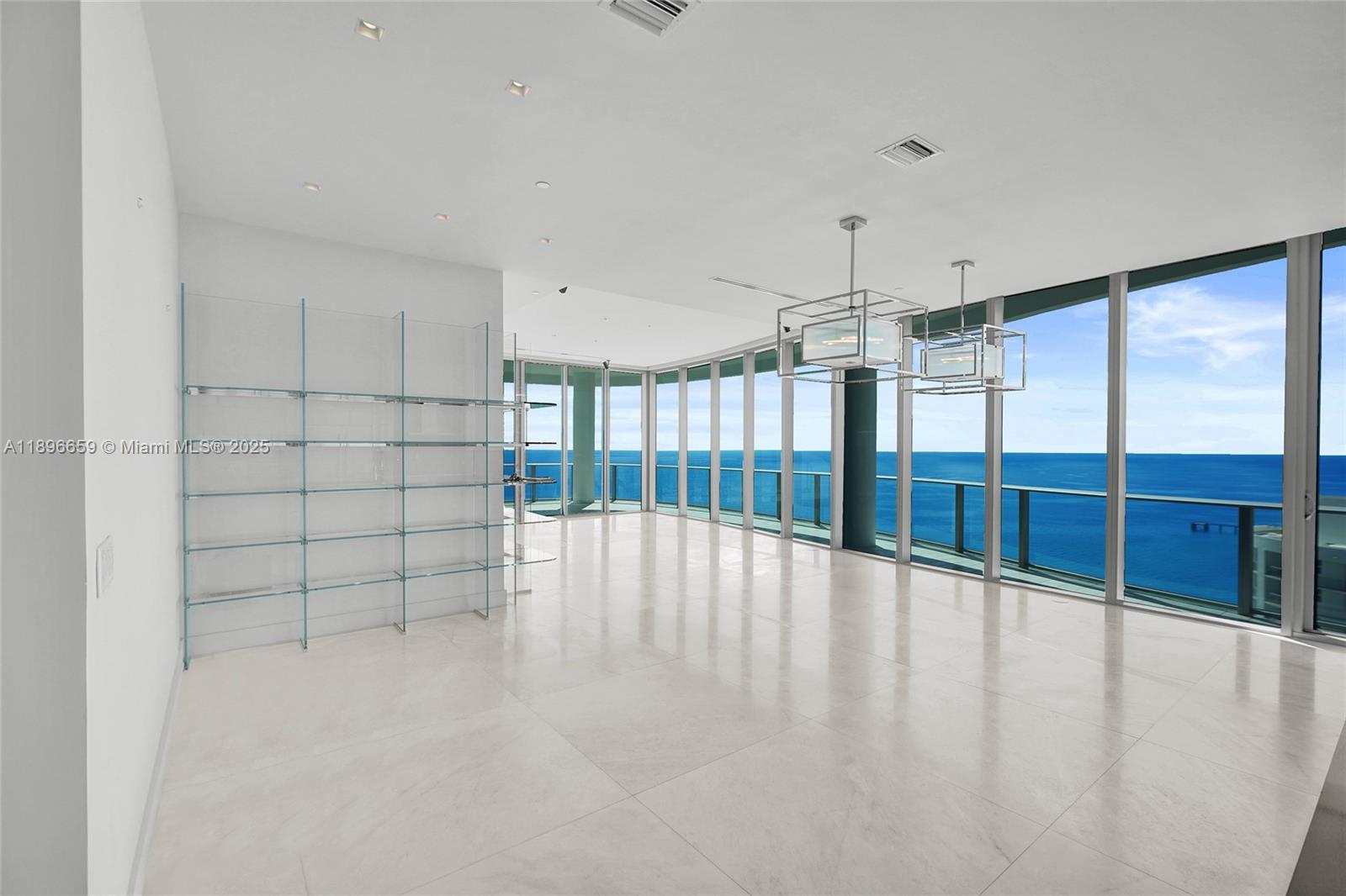 17475 Collins Avenue, Unit 2302 Sunny Isles Beach, FL 33160 - Photo 3 of 42 a view of an empty room with a window