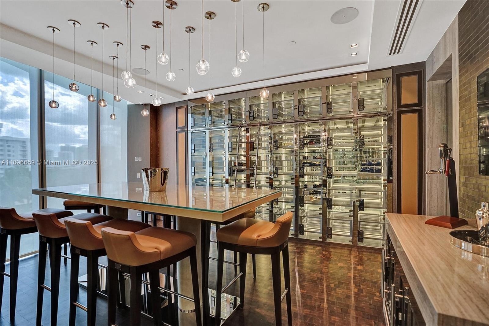 17475 Collins Avenue, Unit 2302 Sunny Isles Beach, FL 33160 - Photo 31 of 42 a bathroom with a double vanity sink and a mirror