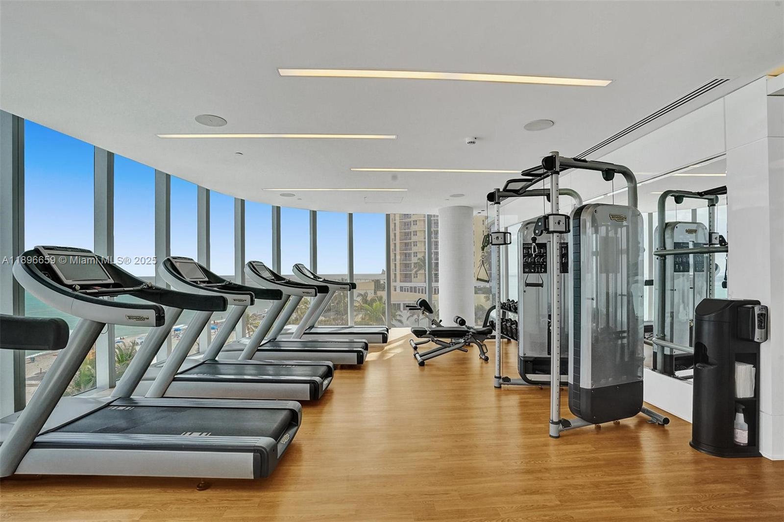 17475 Collins Avenue, Unit 2302 Sunny Isles Beach, FL 33160 - Photo 35 of 42 a view of a room with gym equipment