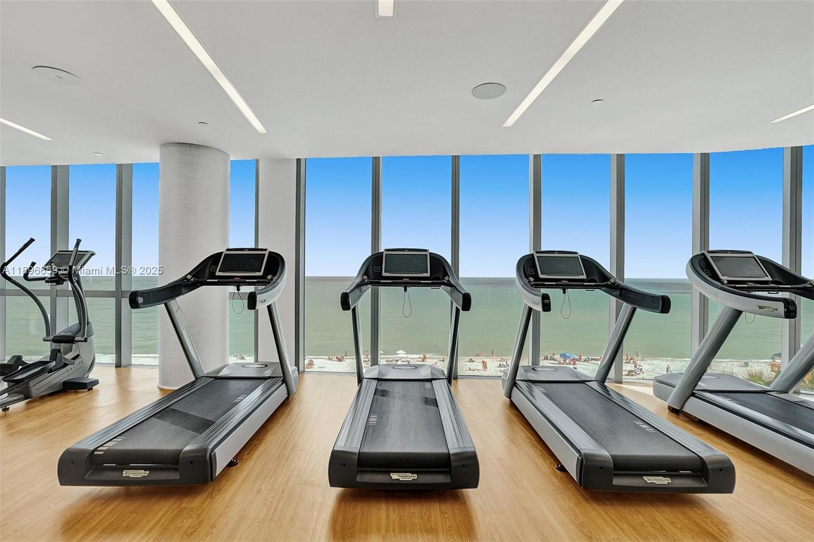 17475 Collins Avenue, Unit 2302 Sunny Isles Beach, FL 33160 - Photo 36 of 42 a room with gym equipment