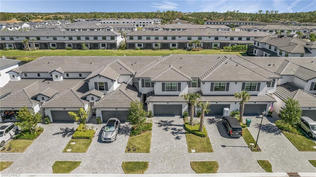 7596 Morgan Way Naples, FL 34119 - Photo 35 of 35 an aerial view of residential houses with outdoor space and ocean view