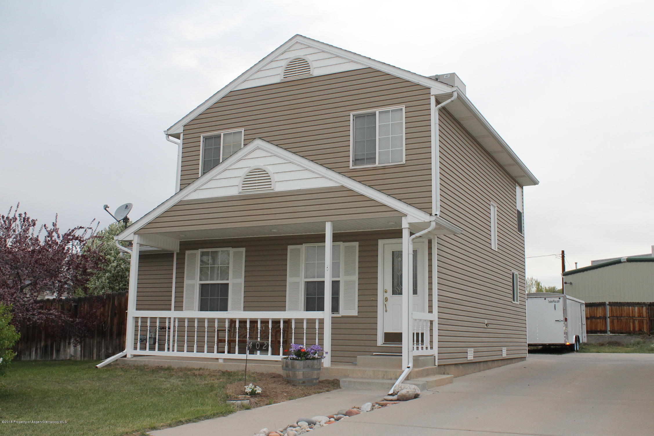402 Columbine Court Rifle, CO 81650 - Photo 1 of 19 a view of a house with a yard