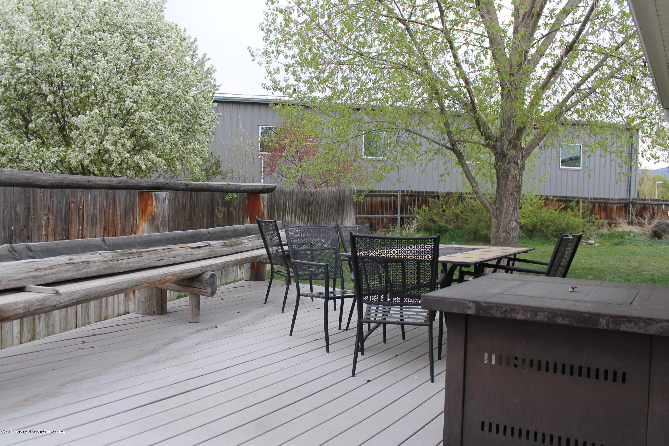 402 Columbine Court Rifle, CO 81650 - Photo 15 of 19 a view of backyard with deck and outdoor seating