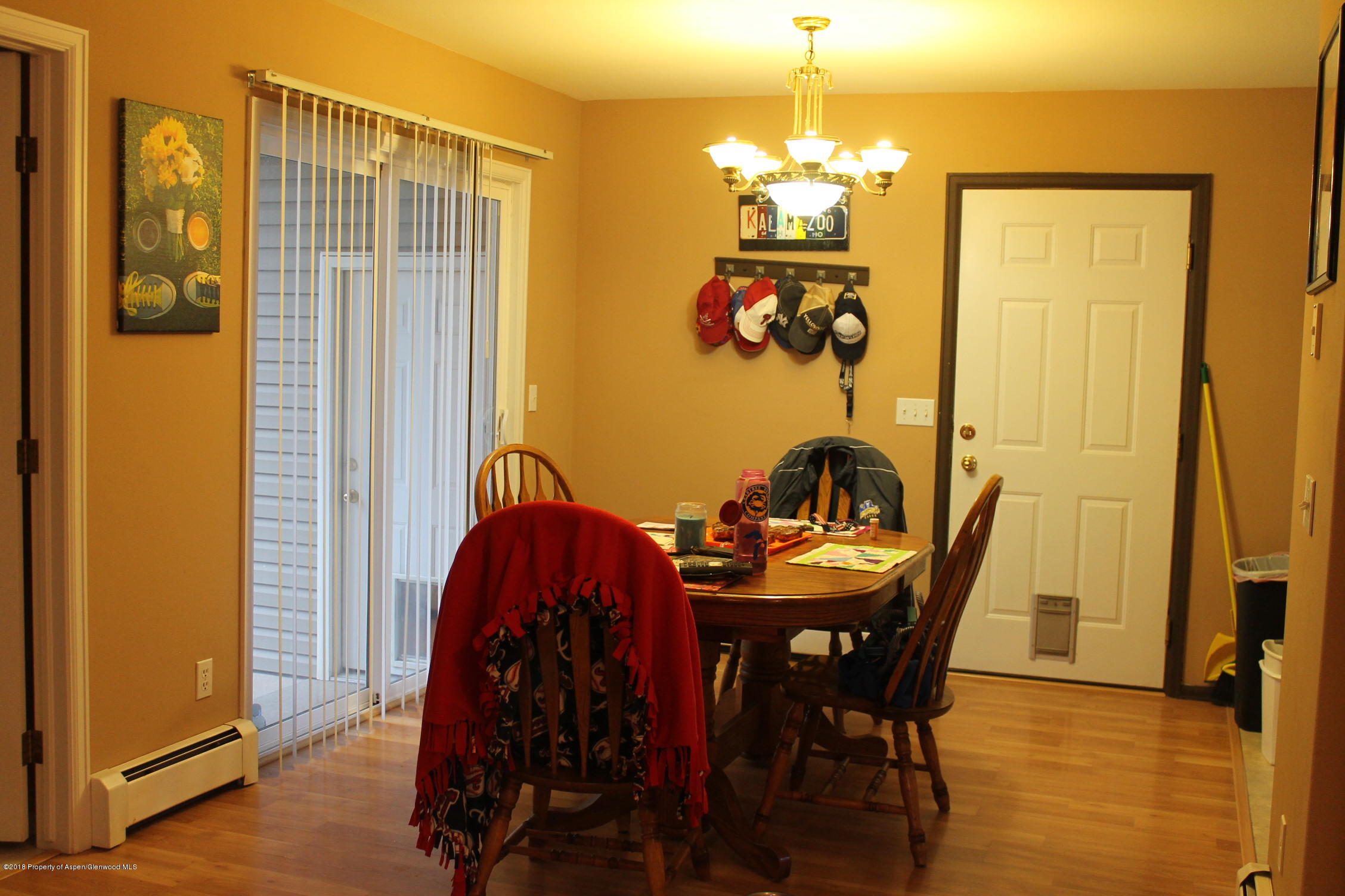 402 Columbine Court Rifle, CO 81650 - Photo 4 of 19 a view of a dining room with furniture and chandelier