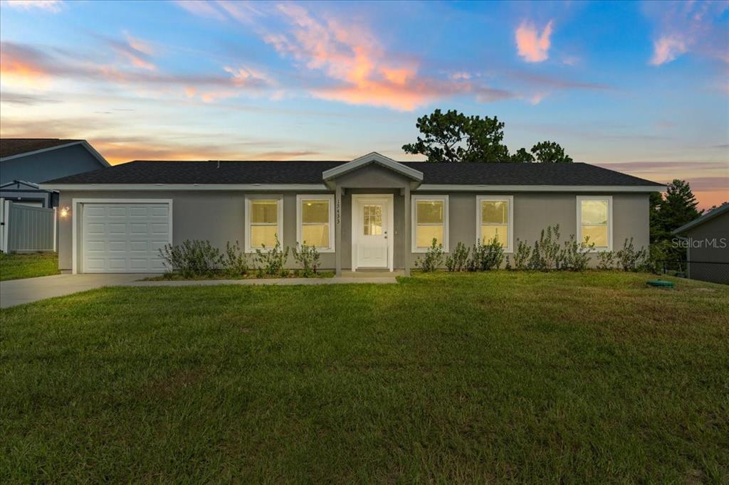 15433 Southwest 47th Avenue Road Ocala, FL 34473 - Photo 1 of 1 a front view of house with yard and green space