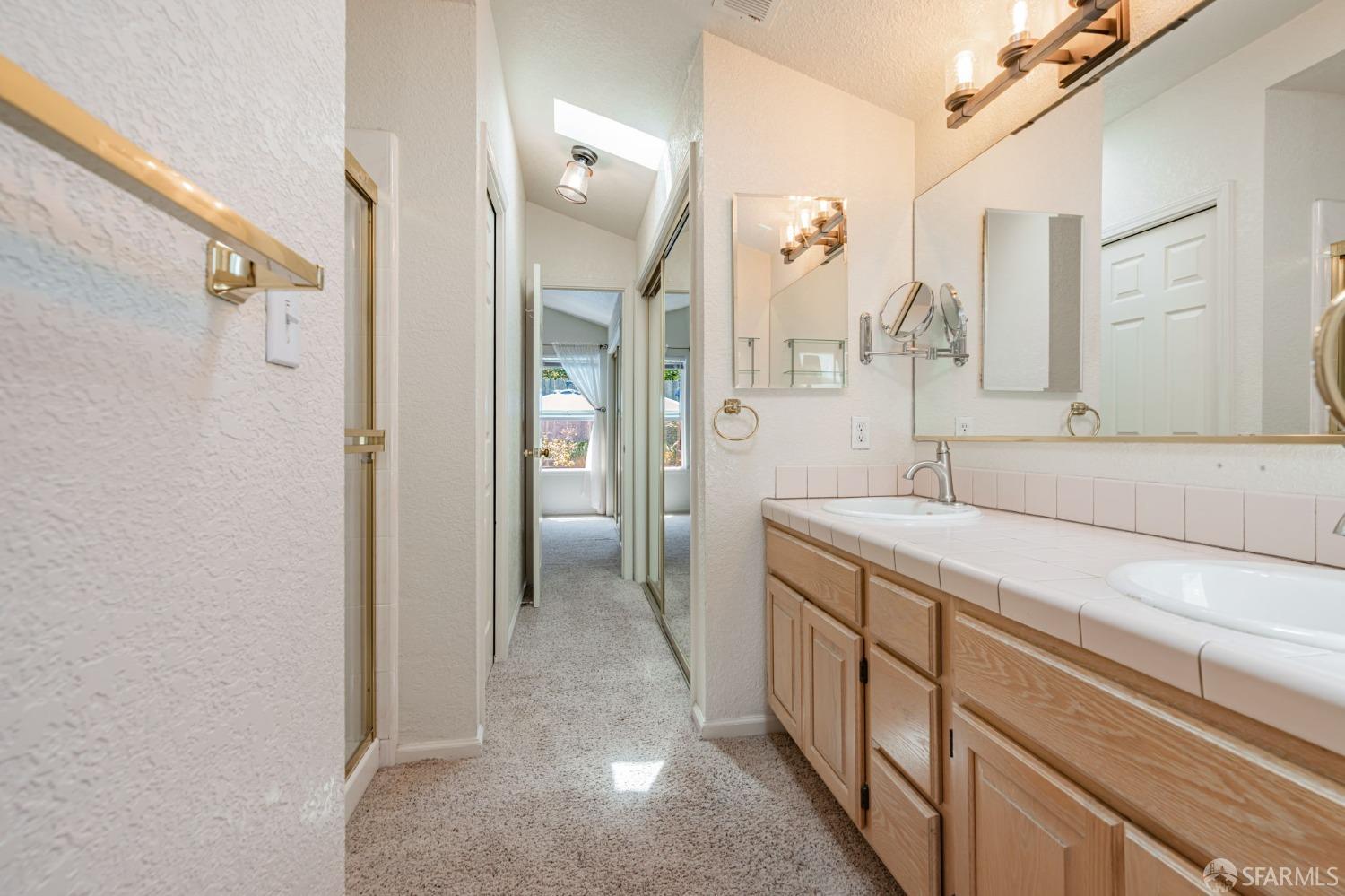 472 Copeland Street Pacifica, CA 94044 - Photo 16 of 31 a bathroom with a double vanity sink mirror and shower