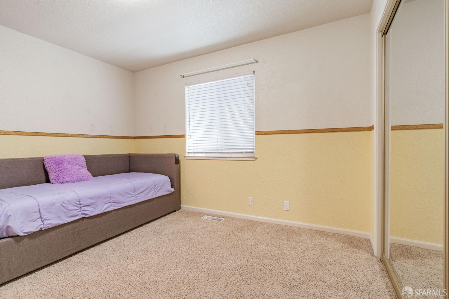 472 Copeland Street Pacifica, CA 94044 - Photo 21 of 31 a bedroom with a bed and a window with wooden floor