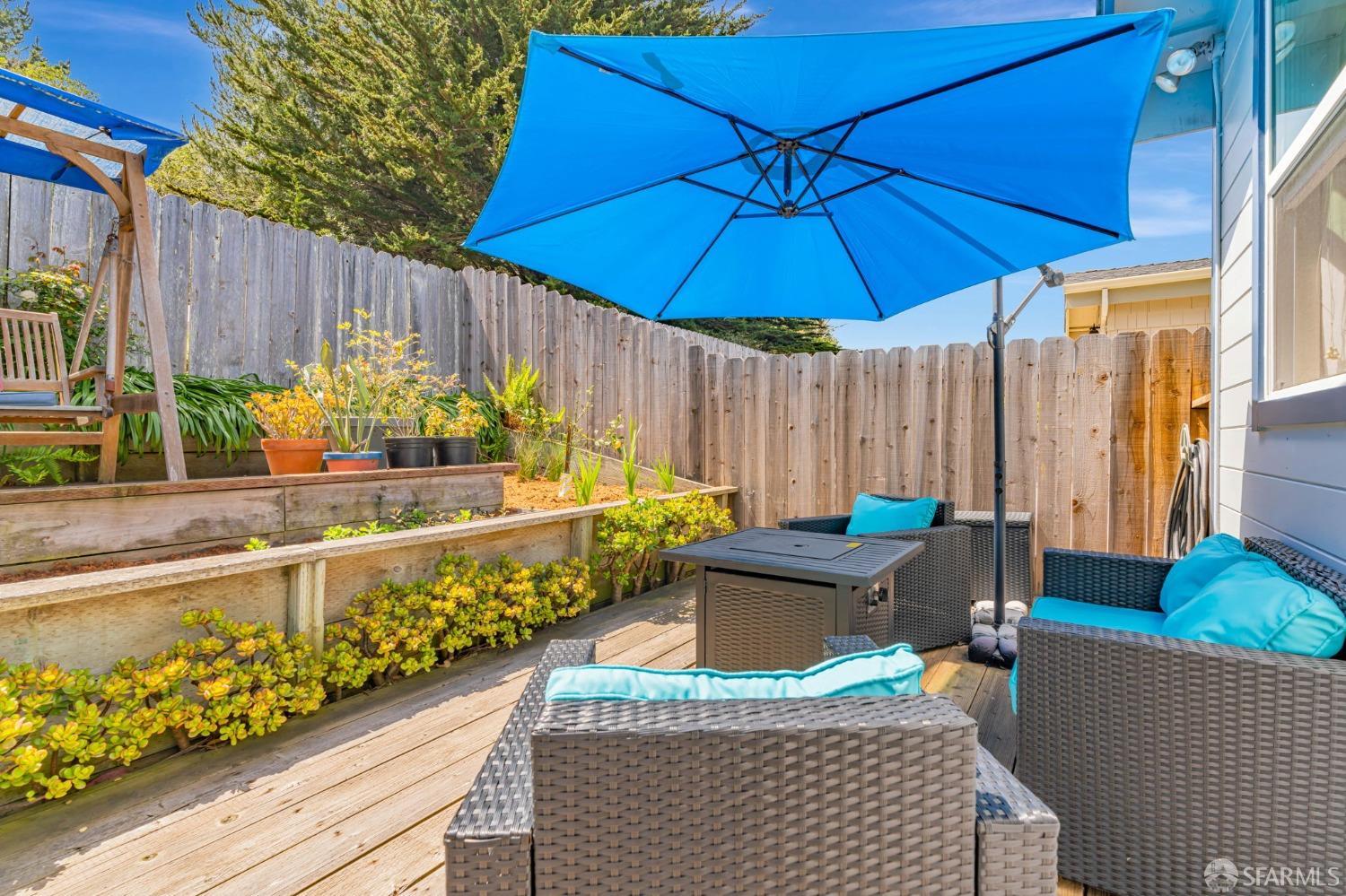 472 Copeland Street Pacifica, CA 94044 - Photo 28 of 31 a view of a balcony with chairs and an umbrella