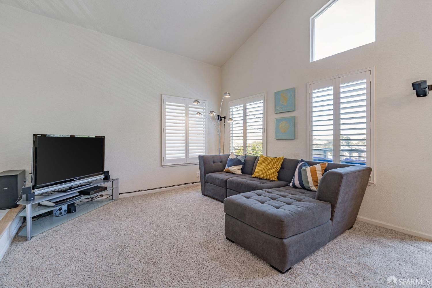 472 Copeland Street Pacifica, CA 94044 - Photo 6 of 31 a living room with furniture and a flat screen tv