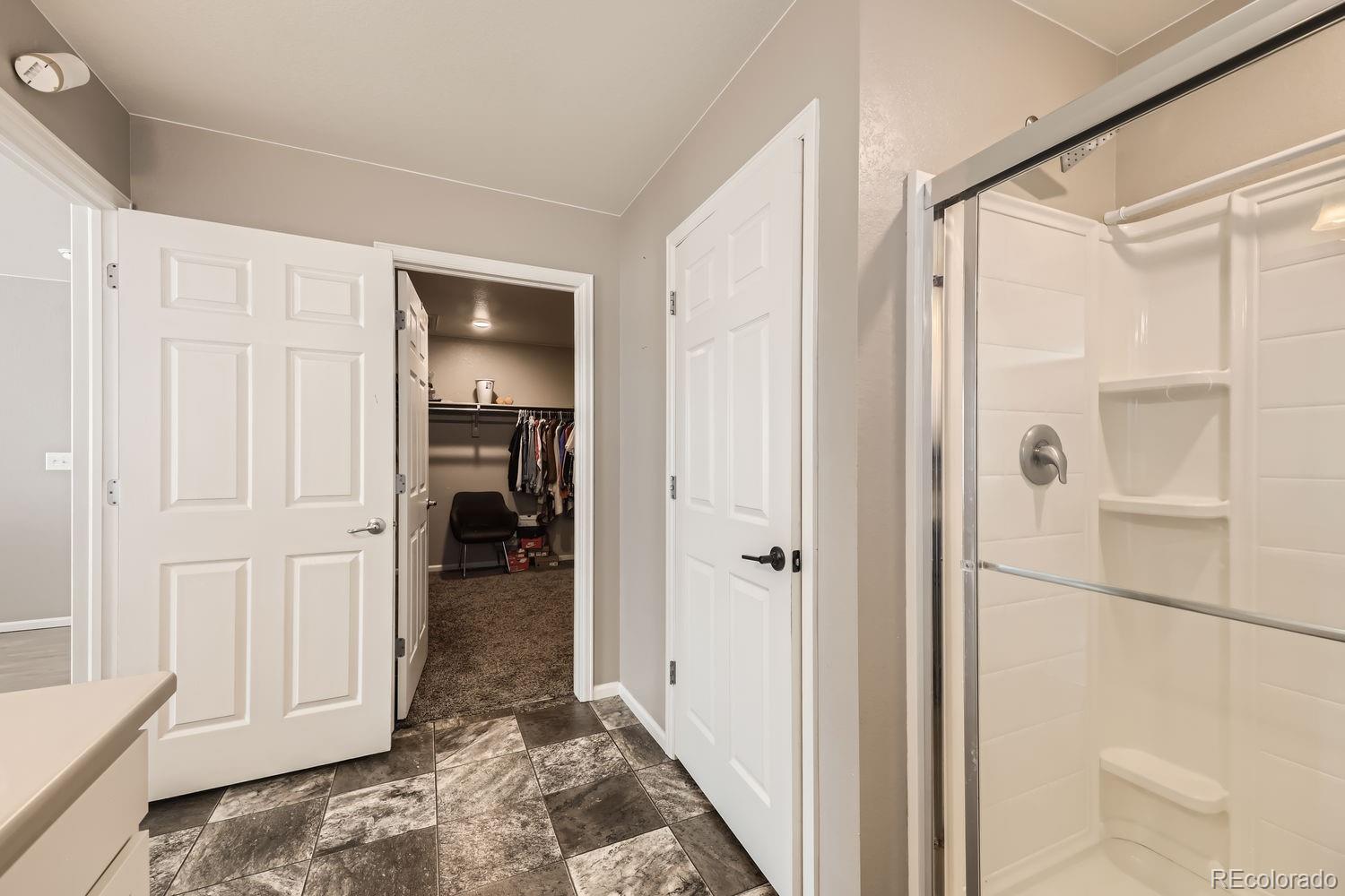 6808 Morrison Drive Frederick, CO 80530 - Photo 17 of 28 a view of a hallway with wooden floor and closet