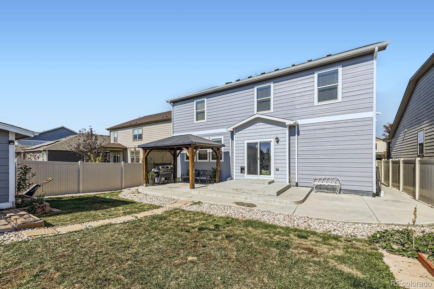 6808 Morrison Drive Frederick, CO 80530 - Photo 28 of 28 a front view of a house with a yard