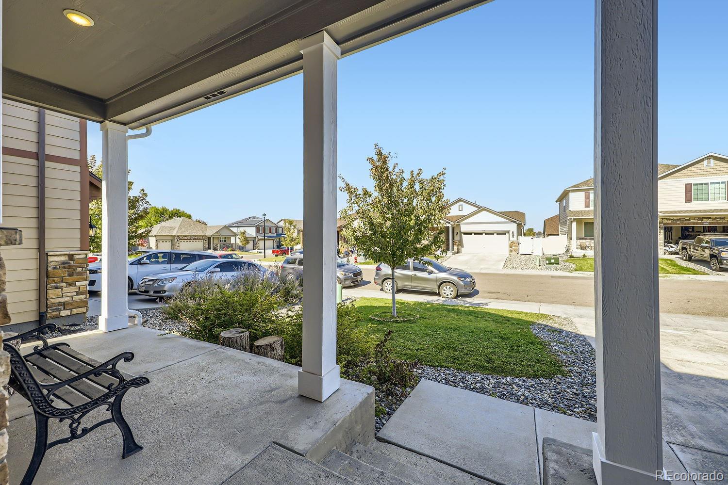 6808 Morrison Drive Frederick, CO 80530 - Photo 4 of 28 a view of a porch with chairs and backyard of the house