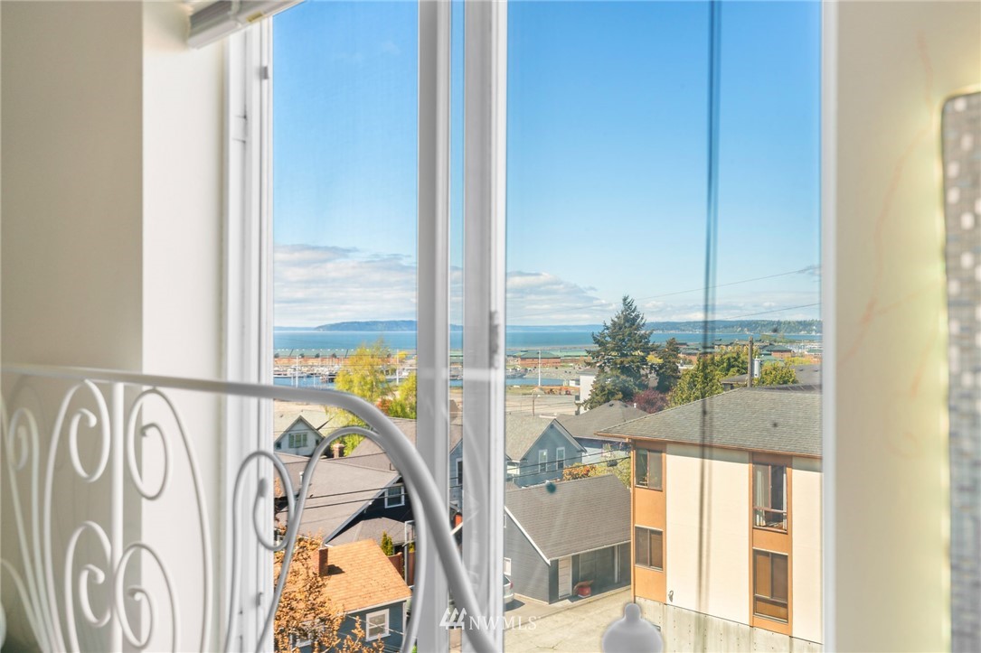 2522 Rucker Avenue, Unit 407 Everett, WA 98201 - Photo 15 of 30 a view of a balcony with a flower plants