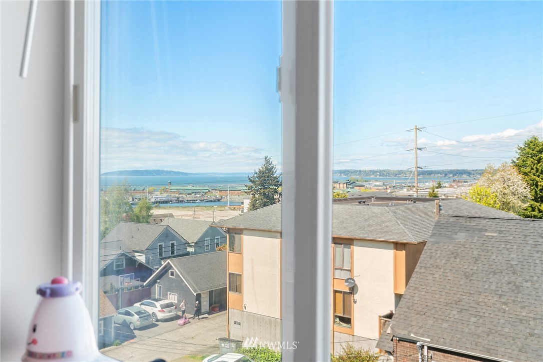2522 Rucker Avenue, Unit 407 Everett, WA 98201 - Photo 18 of 30 a view of a balcony with table and chairs