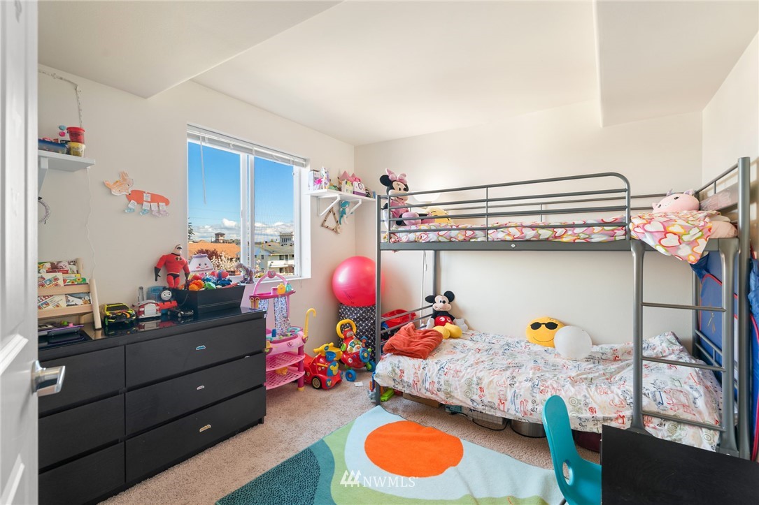 2522 Rucker Avenue, Unit 407 Everett, WA 98201 - Photo 19 of 30 a bed room with a bed and a window